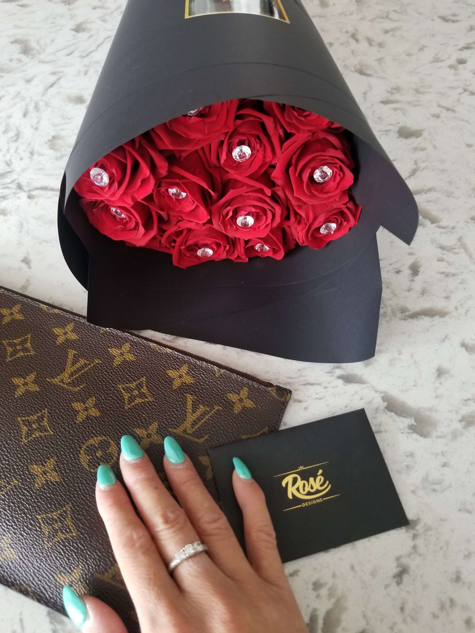 1 Dozen Red Rose Wrapped Bouquet with Louis Vuitton pouch
